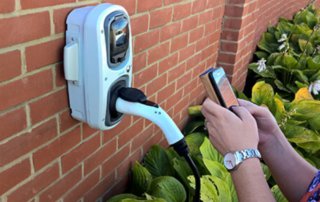 RolecEV Smart Chargepoint being used by man with a mobile phone