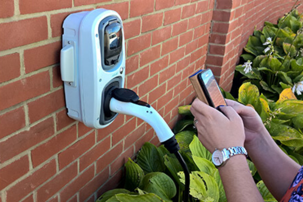 RolecEV Smart Chargepoint being used by man with a mobile phone